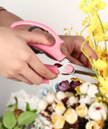 Person using Pro Grade Garden Pruning Scissors With Comfort Grip Handle Set Razor Sharp SK5 Stainless Steel Floral Scissors For Arranging Flowers And Trimming Plants Ergonomic Grip Durable Gardening Tool Pack Of 4 Mixed Colors to trim yellow flowers.