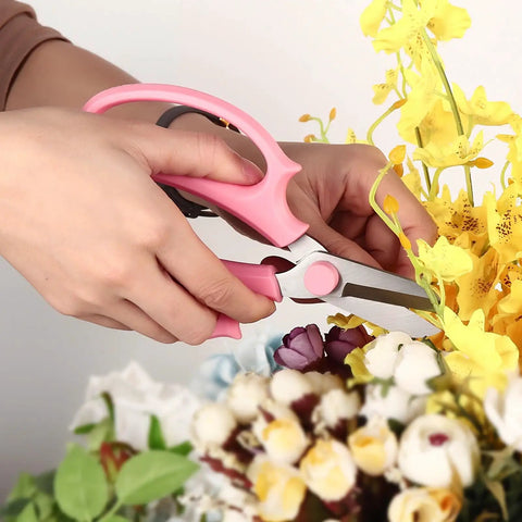 Person using Pro Grade Garden Pruning Scissors With Comfort Grip Handle Set Razor Sharp SK5 Stainless Steel Floral Scissors For Arranging Flowers And Trimming Plants Ergonomic Grip Durable Gardening Tool Pack Of 4 Mixed Colors to trim yellow flowers.