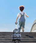 Child pulling Foldable Backpack Trolley With Aluminum Alloy Frame Six Wheel Luggage Cart for school on stairs.