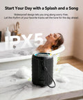 Beach Essentials Bluetooth Speaker With Crystal Clear Sound IPX5 Waterproof on a bathroom counter beside a bathtub.