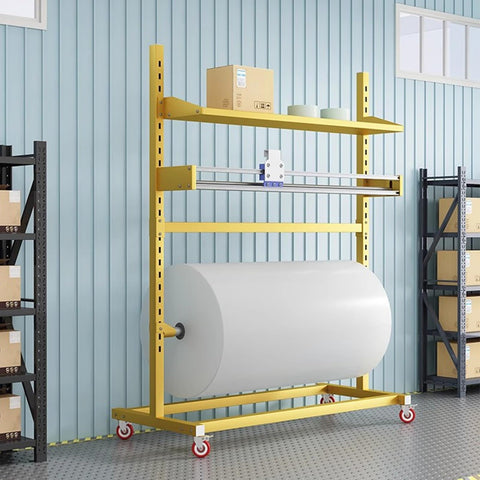 Heavy Duty Floor Stand Bubble Wrap Dispenser With Zero Hassle Setup For Smooth Packing And Moving handles a large roll in a warehouse setting.