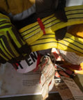 Worker handling a 60mm yellow round sling endless lifting strap, heavy duty 6 foot rigging sling for construction hoisting.