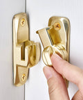 Close-up of the Dual 90 180 Degree Barn Door Latch Lock in Zinc Alloy shown being installed on a door for security