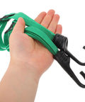 Hand holding green Lightweight Adjustable Helmet Net Strap With Elastic Nylon And Rubber For Travel And Electric Bike Use