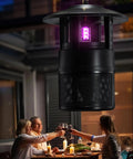 Outdoor Mosquito Trap With Lighting And Sleep Timer That Attracts Mosquitoes Flies Moths Gnats Wasps Beetles And No See Ums Indoor Or Outdoor Bug Zapper With 395nm UV Light For Fast Quiet Hassle Free Catch hanging over outdoor dining area