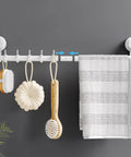 Suction Cup Towel Bar 24 Inch Adjustable No Drill Removable Wall Mounted Towel Rack With 5 Sliding Hooks Easy Install Holds Up To 11 Lb 5 Kg White Perfect For Shower Kitchen Door showing towels and brushes hanging