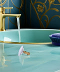 Copper Bathtub Drain Stopper with Bounce Design for Easy Control positioned near a stylish bathtub and faucet.