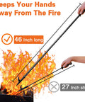 46 Inch Extra Long Fire Pit Poker With Extended Reach For Fireplace Campfire And Wood Stove Use Heavy Duty Wrought Steel Tool Built To Last Rust Resistant Black Finish Ideal For Indoor Or Outdoor Fires in use over flames