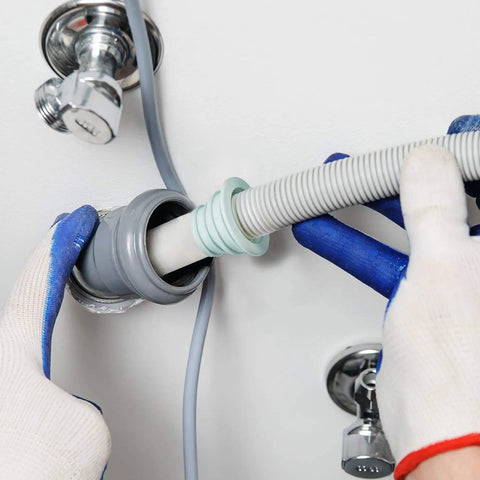Hands installing Silicone Drain Seal Plug 4 Pack For Toilets, Bathrooms, Kitchens And Washing Machines Odor Control