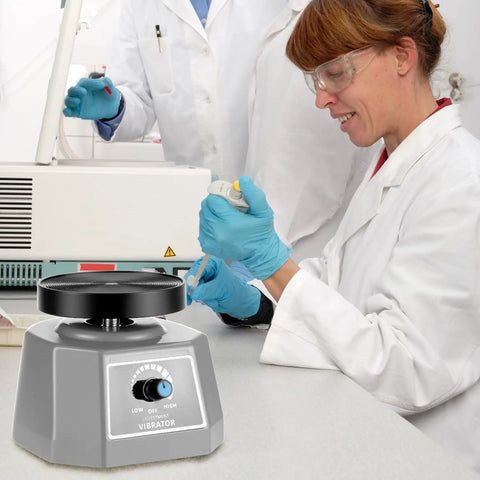 Lab technician using 4 Inch Lab Vibrator Shaker Oscillator 110V For Plaster And Gypsum Mixing Small Round Mixer Machine