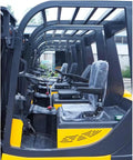 Compact Electric Forklift Two Point Five Ton Load Capacity side view of operator seats and controls for smooth navigation.