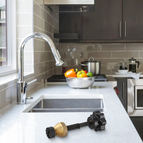 The Badass Faucet Reseating Tool With Precision Guide And Twin Steel Cutters To Nix Stubborn Leaks and Chip Off Mineral Crust Fast on a kitchen counter.