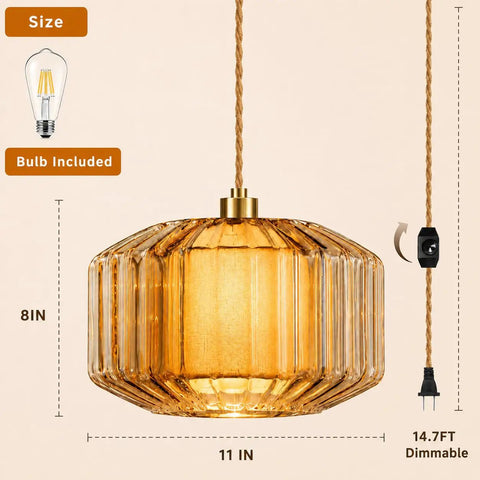Plug In Dimmable Pendant Light Featuring Amber Drum Glass And Gold Fabric Inner Shade, 11in wide, 8in tall, with 14.7ft dimmable cord.