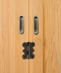 Vintage Iron Cabinet Hinges 20 Piece Small Butt Hinges for wood cabinets, butterfly design, in use on a cabinet door.