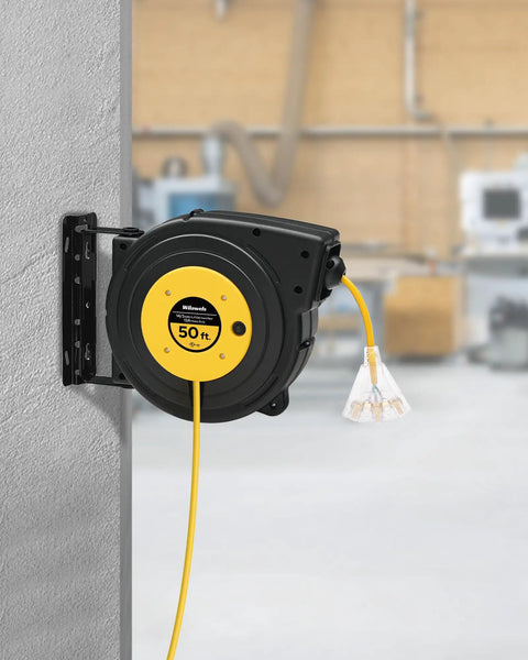Heavy Duty Retractable Extension Cord Reel 50 Feet Long With Rugged 14 AWG Wiring mounted on wall with three outlets visible.