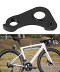 Direct Replacement Derailleur Hanger S206000001 For Specialized Aethos And Tarmac SL8, shown with a white racing bike outdoors.