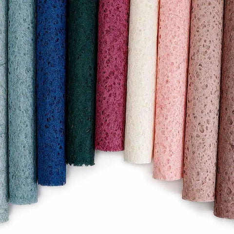 Colorful rolls of Five Sheet Flower Wrapping Mesh Paper in 19.68 inches by 27.56 inches perfect for bouquets and gift packaging
