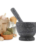 Granite Pattern Mortar And Pestle Set Manual Garlic And Seasoning Grinder With Non Slip Base For Fresh Spices, shown with herbs.