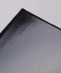 Close-up of heavy duty silicone battery heater pad corner featuring textured surface for effective heat distribution. Skip The Morning Chill With Heavy Duty Silicone Battery Heater Pad Featuring Smart Thermostat Control And 120V Electric Car Battery Warmer Mat To Keep Your Ride Running Smooth All Winter Long.