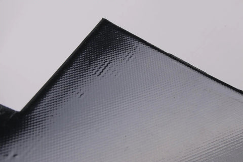Close-up of heavy duty silicone battery heater pad corner featuring textured surface for effective heat distribution. Skip The Morning Chill With Heavy Duty Silicone Battery Heater Pad Featuring Smart Thermostat Control And 120V Electric Car Battery Warmer Mat To Keep Your Ride Running Smooth All Winter Long.