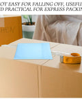 Milk Blue Bubble Mailer Bags 100 Pack Self Sealing 11x15 Plus 4 Inch on cardboard boxes with tape dispenser