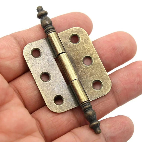 Close-up of Eight Piece Vintage Antique Brass Flap Hinges With Lengthened Axis for Wooden Boxes Jewelry Cases Cabinets And Cupboards