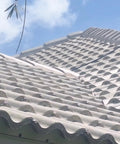 Heavy Duty Tile Roof Glaze And Clear Shielding Sealant With Urethane Reinforced Strength For Tough As Nails Weather Barrier And A Sleek Satin Finish That Gonna Save Your Tiles From Failing In A Practical Five Gallon Size on a textured clay roof.