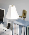 Polished Brass Wall Swing Arm Lamp With Off White Fabric Shade Delivers Classic Vibe And Traditional Style 15 Inch Height 25 Inch Width 24 Inch Depth 3 Way Dimmable Ambient Lighting For Hallways Desks And Reading Nooks in modern office setup.