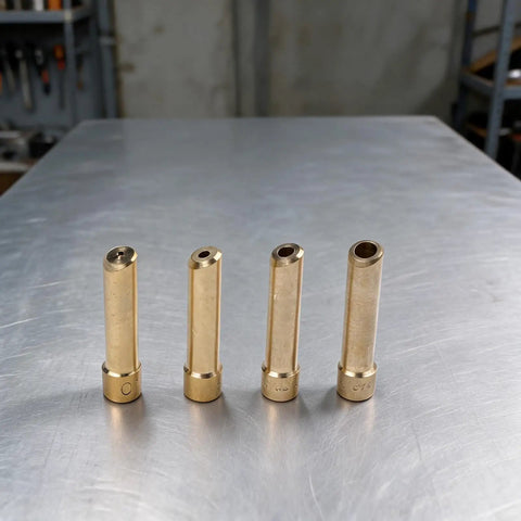 Precision Fit Weldy Collet Kit For Tig Torch DB SR WP Models 17 18 26, 4-Piece Set showing brass collets arranged on a metal surface.