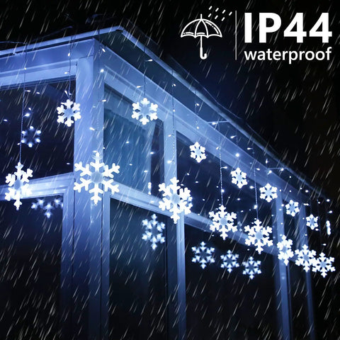 Outdoor Snowflake Christmas Lights 17.22 Feet 264 LED Snowflake Icicle Lights With 22 Drops Waterproof White glowing on eaves