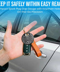 Hand holding car keys with a Three Pack Spark Plug Gap Gauge Tool For Mechanics attached, chrome finish, in front of car door