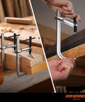 Jorgensen 6-inch steel bar clamps, 2-pack, heavy-duty drop-forged; shown clamping wood.