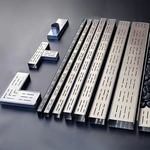 Beefy Heavy Duty Stainless Outdoor Trench Drainage Kit With Slim Low Profile Grate For Courtyard Lawn And Driveway Rust Resistant 304 Stainless Steel Splicable Design For Quick Easy Custom Drain Lines shown disassembled with L connectors