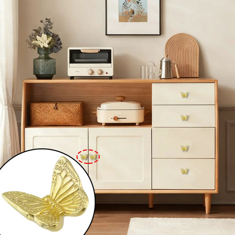 Butterfly Drawer Knobs Set Of 6 In Dope Gold Brass Finish For Cabinets on wooden dresser with decor
