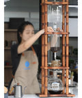 Dope Slow Drip Cold Brew Coffee Tower With Adjustable Dripper And Spacious 3000Ml Glass Jug in use with coffee brewing.