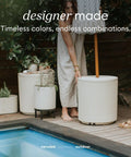 Woman beside Patio Must Have Weatherproof Umbrella Side Table With Hole Durable Plastic Stone Combo on poolside deck