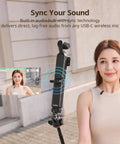 Woman using the 5000mAh Battery Grip For Pocket 4 By 3 Camera With 20W Fast Charge Wireless Microphone Pass Through.