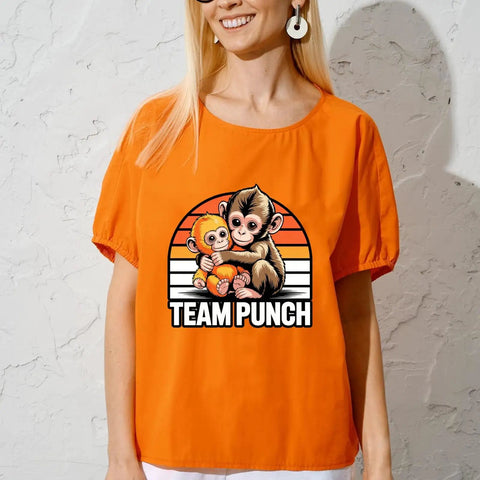 Orange shirt with "Team Punch" featuring cute babys monkey punchs trends meme DTF transfers for DIY clothing and T shirts.
