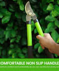 Hands gripping Bypass Loppers 15 Inch Beefy Heavy Duty Garden Pruner with comfort handles against greenery backdrop