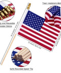 Close-up of an 8x12 inch American flag on a solid wooden pole with a safety spear tip, part of 50 Pack 8x12 Inch American Flags On Sticks