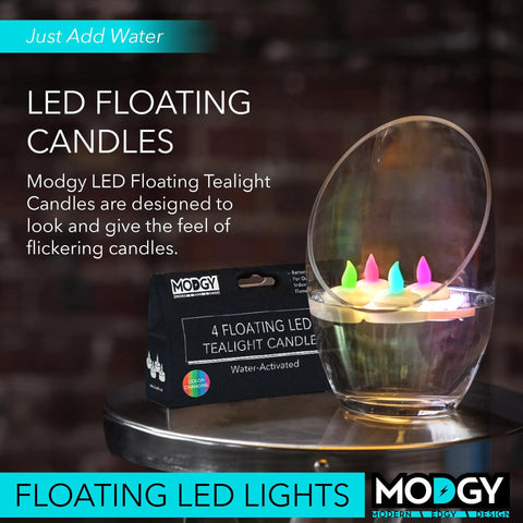 Color Changing Lumizu Water Activated LED Floating Candles Four Pack For Poolside Tables And Outdoor Ambiance Lit Multi Color Glow Battery Powered Flicker Without A Wick next to product box on table