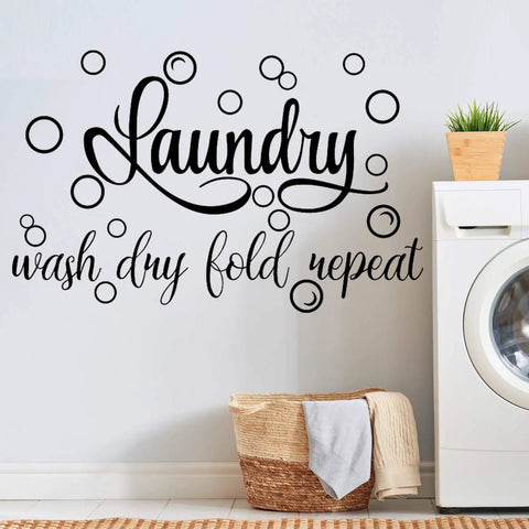 Laundry Room Wall Decal Set With Wash Dry Fold Repeat Bubble Stickers Funny Sign For Home Decor Easy Peel And Stick Removable Black Wall Art Large 19.7 By 30.7 Inches displayed above a laundry basket and washing machine.