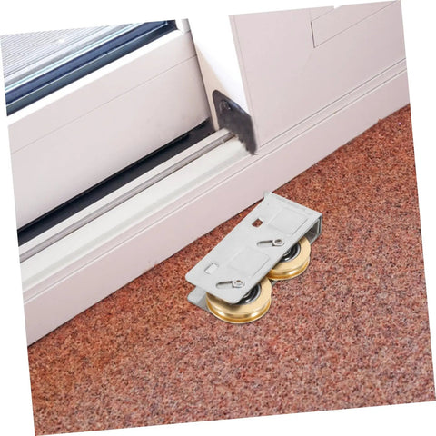 Get Your Track Setup Running Like Butter With These Heavy Duty Sliding Door And Window Pulleys Crafted From Premium Stainless Steel And Fitted With Dual Copper Wheels For Effortless Everyday Glide. Close-up of silver pulleys with dual copper wheels on carpet.
