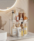2 Tier Lazy Susan Turntable Organizer For Narrow Cabinets holding cosmetics on a countertop, made of clear plastic, 235 mm diameter