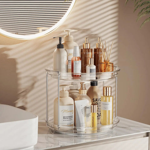 2 Tier Lazy Susan Turntable Organizer For Narrow Cabinets holding cosmetics on a countertop, made of clear plastic, 235 mm diameter