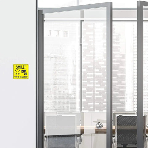 Smile Youre On Camera Signs 7 By 7 Inch 8 Pack Security Notice Stickers For Home Office And Outdoors Deterrent Alerts Visitors Theyre On Camera And Helps Keep Your Family And Property Safe With This Easy To Install Sign Set. yellow vinyl camera sign on office glass door