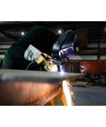 Welder using Savage A40 Black Auto Darkening Welding Helmet Pro Grade With External Shade Adjustment From DIN 9 To DIN 13 in workshop