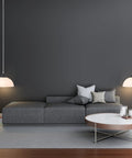 1 Light Plug-In Pendant Light In Dark Bronze With Frosted Shade And Adjustable Clear Cord Height above a modern living room