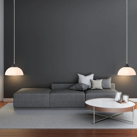 1 Light Plug-In Pendant Light In Dark Bronze With Frosted Shade And Adjustable Clear Cord Height above a modern living room