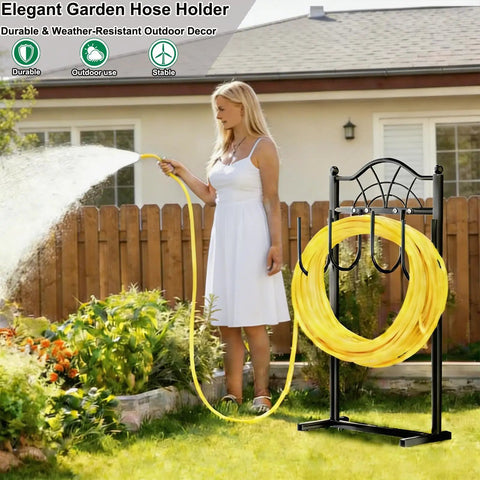 Heavy Duty Freestanding Garden Hose Holder With Four Prongs A Real Workhorse Metal Hose Reel Stand That Holds Up To 100 Feet Of Hose Great For Outdoor Yards And Lawns Black in a garden setting with a woman using yellow hose